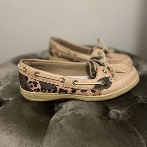 Sperry boat shoes with animal print.